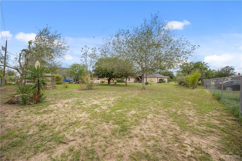 6020 North Doolittle Road Edinburg, TX 78542 - Photo 16 of 23 Expansive outdoor area featuring a combination of grass and natural ground cover