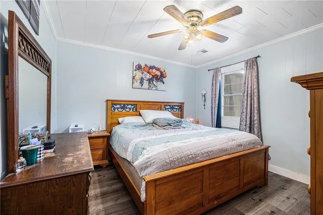 a bedroom with bed and a chandelier