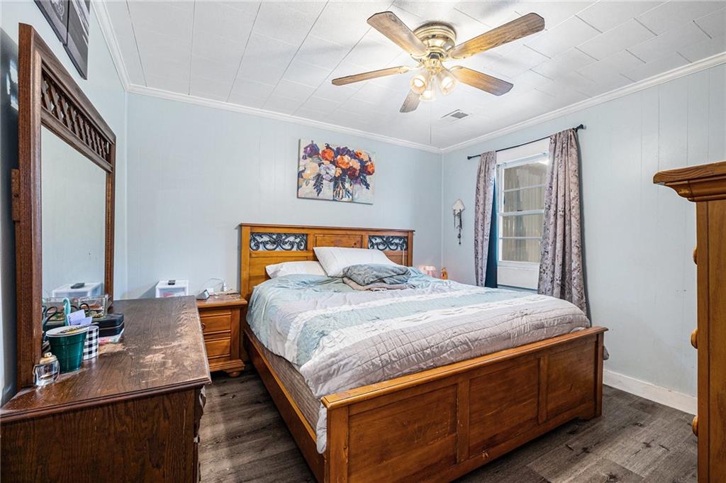 5831 Mize Road Toccoa, GA 30577 - Photo 11 of 28 a bedroom with bed and a chandelier