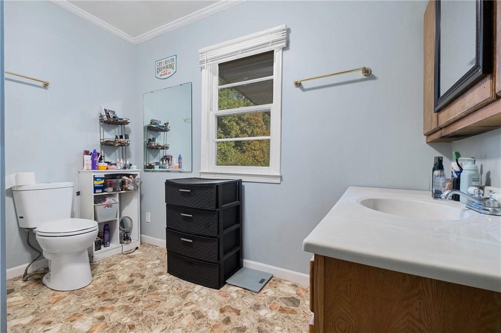 5831 Mize Road Toccoa, GA 30577 - Photo 13 of 28 a bathroom with a sink toilet and a window