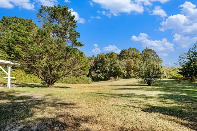 a view of a yard with an outdoor space