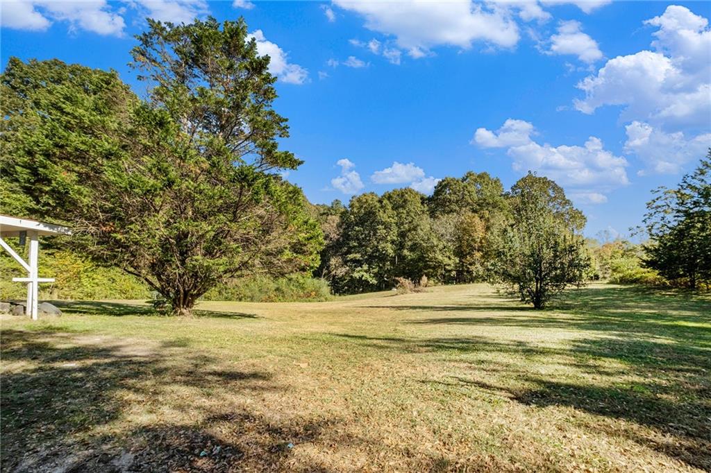 5831 Mize Road Toccoa, GA 30577 - Photo 22 of 28 a view of a yard with an outdoor space