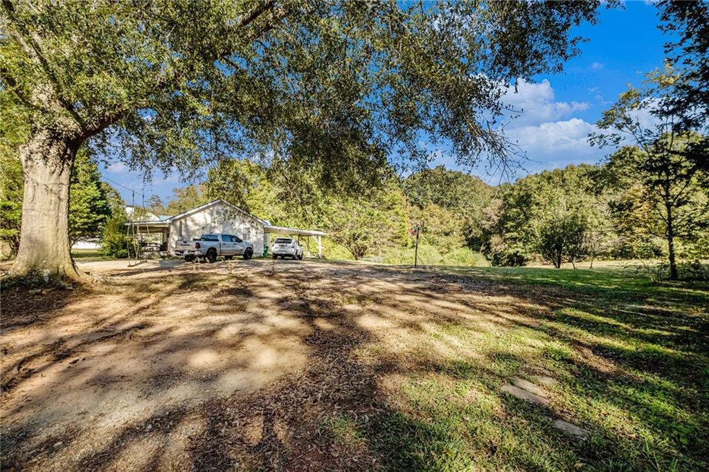 5831 Mize Road Toccoa, GA 30577 - Photo 28 of 28 a view of yard with tree and wooden fence
