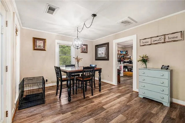 a view of a dining room with furniture