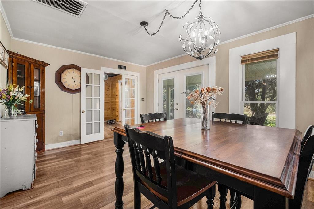 5831 Mize Road Toccoa, GA 30577 - Photo 5 of 28 a view of a dining room with furniture window and wooden floor