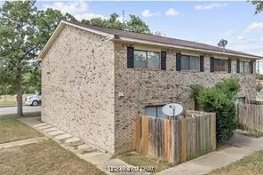 a front view of a house with parking