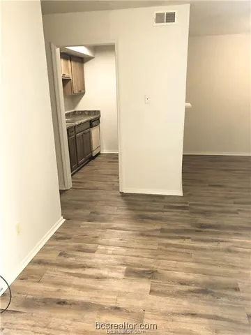 a view of a kitchen from the hallway