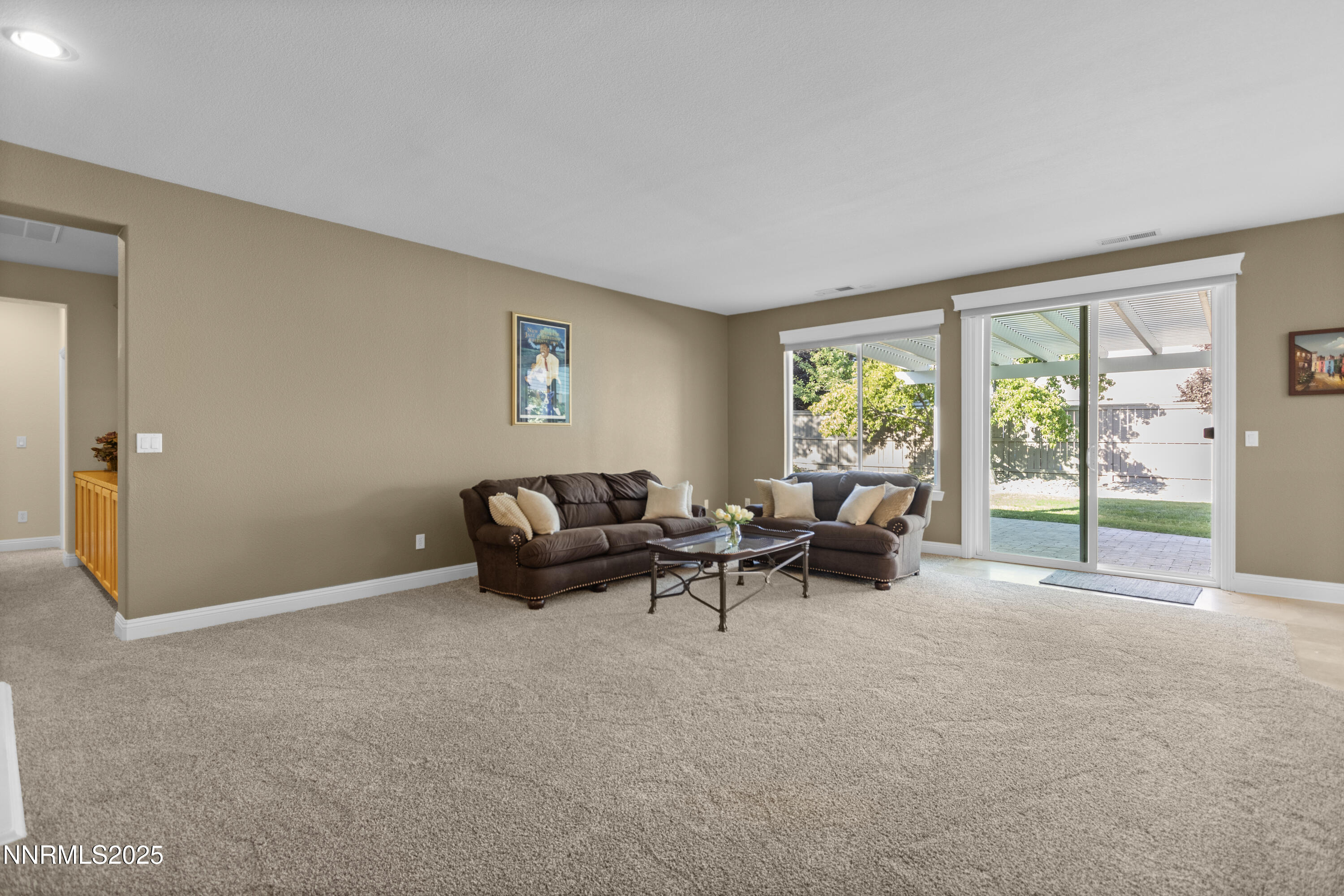 650 Caspian Court Reno, NV 89521 - Photo 18 of 40 a living room with furniture and large windows