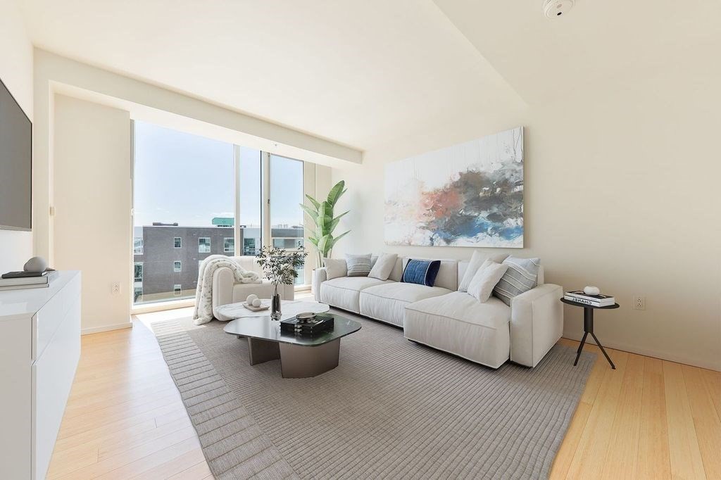 2 Earhart Street, Unit 720 Cambridge, MA 02141 - Photo 14 of 40 a living room with furniture and a large window