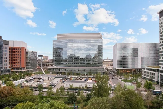 a large building with a yard in front of it