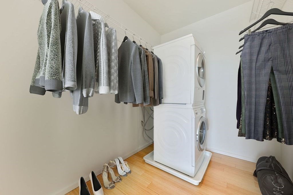 2 Earhart Street, Unit 720 Cambridge, MA 02141 - Photo 10 of 40 a view of walk in closet with clothes and shoes