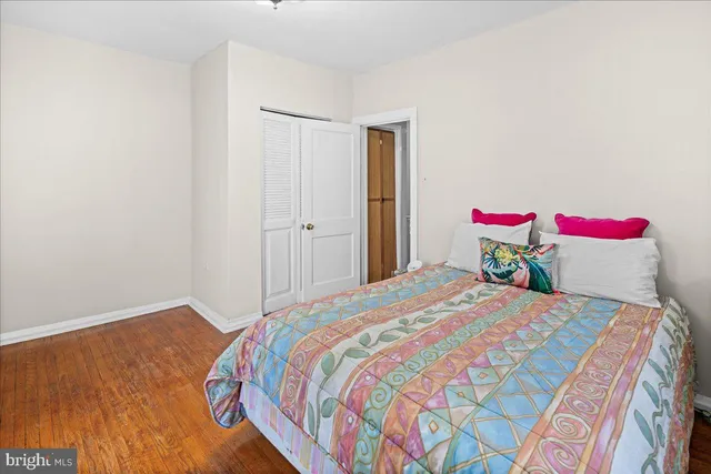 a bedroom with a bed and a closet