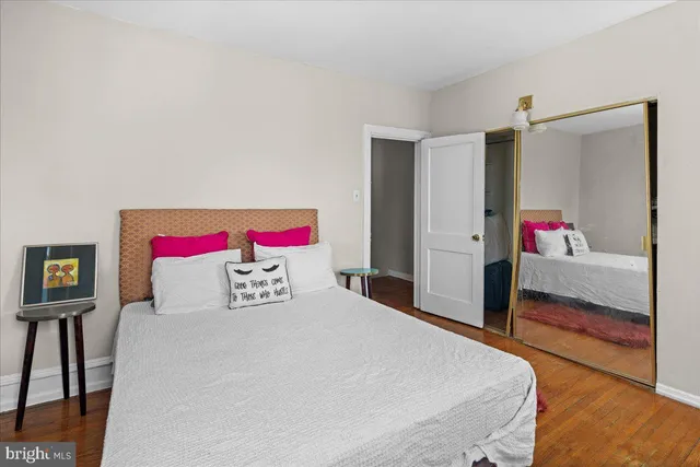 a bedroom with a bed and a dresser