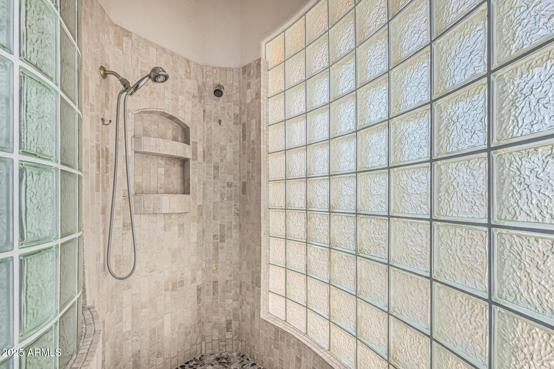 15639 West Peak View Road Surprise, AZ 85387 - Photo 49 of 131 a bathroom with a glass shower door