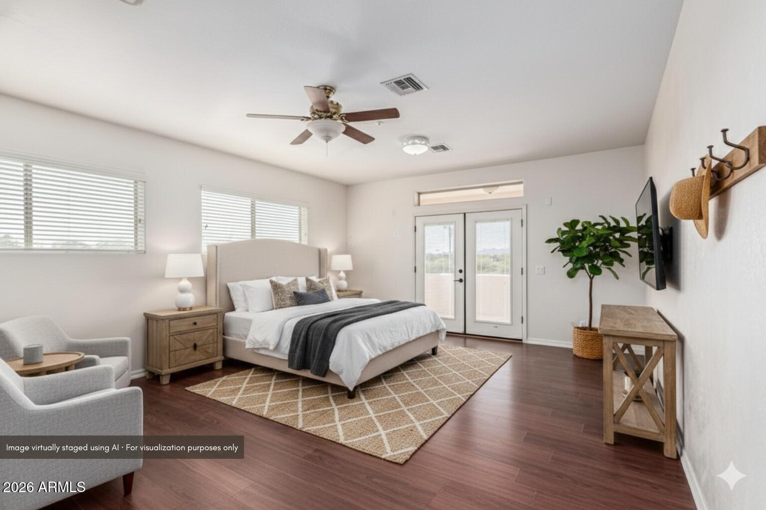 15639 West Peak View Road Surprise, AZ 85387 - Photo 61 of 131 a bed room with a bed window and a couch