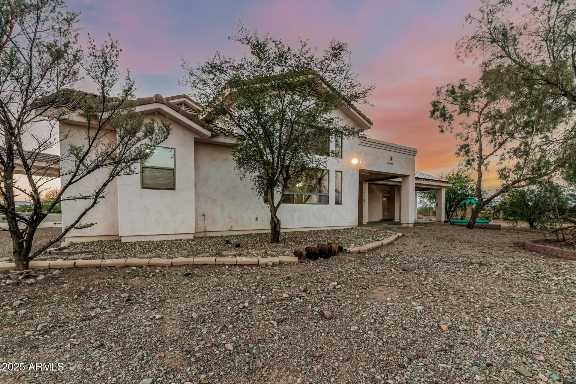 15639 West Peak View Road Surprise, AZ 85387 - Photo 7 of 131 Rear Exterior Twilight