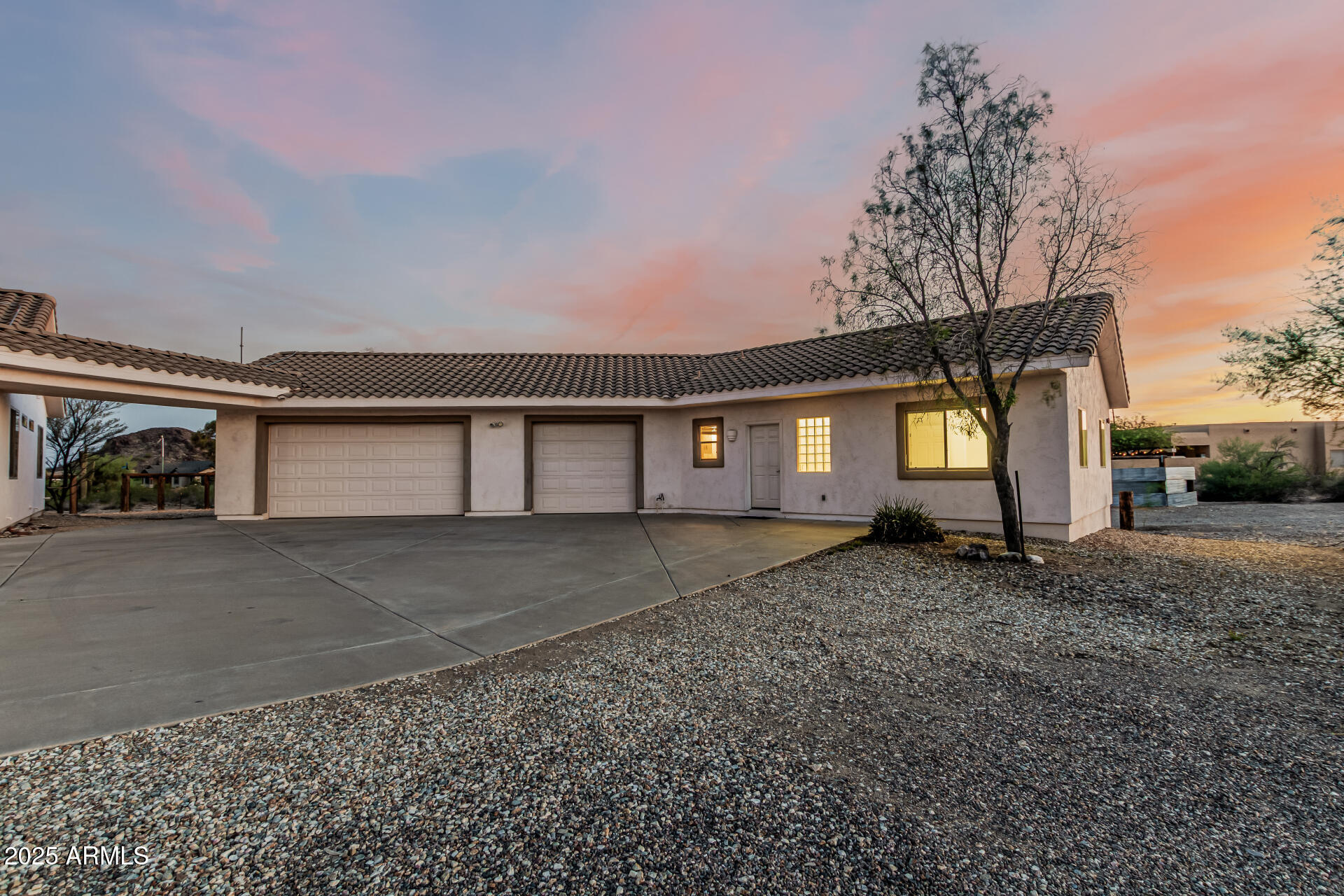 15639 West Peak View Road Surprise, AZ 85387 - Photo 99 of 131 a view of a house with a yard and garage