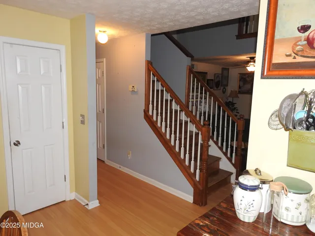 a view of entryway with wooden floor