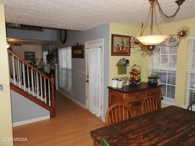 a view of a dining room with furniture