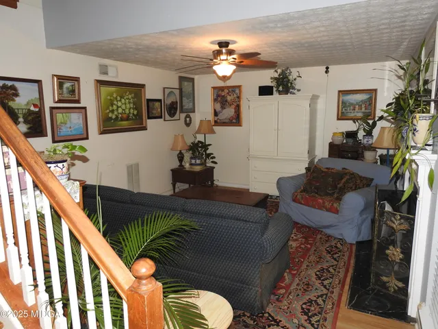 a living room with furniture and flat screen tv