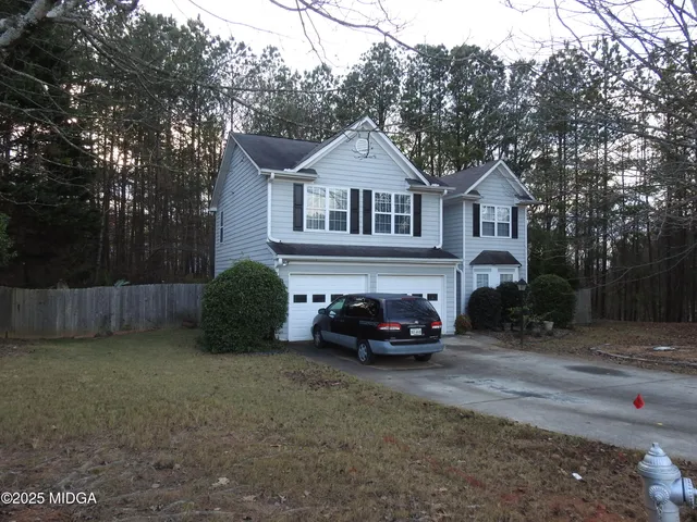 a car parked in front of a house