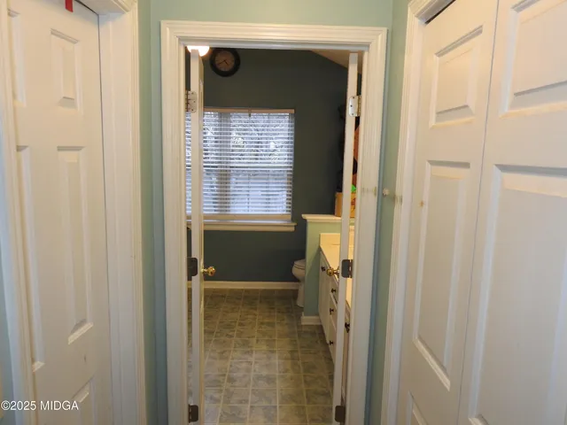 a bathroom with a toilet sink and shower