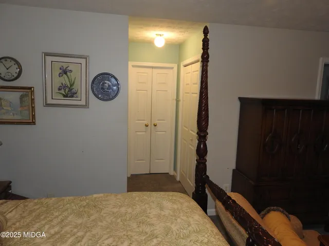 a view of a hallway with paintings on the wall