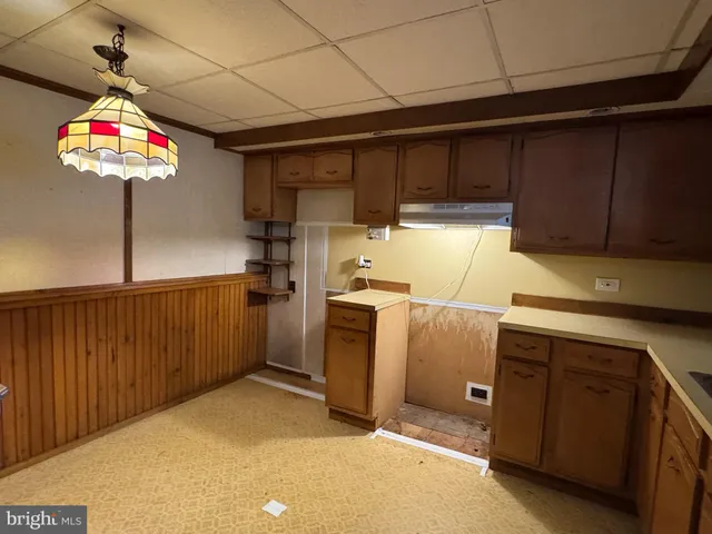 a view of a kitchen with a sink and dishwasher