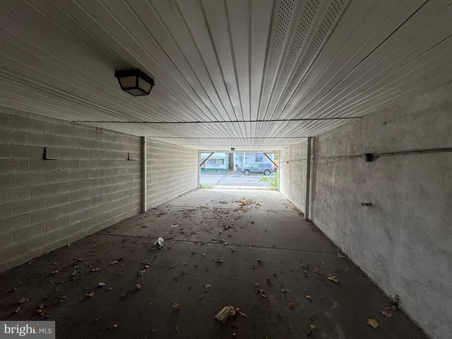 a view of an empty room with furniture
