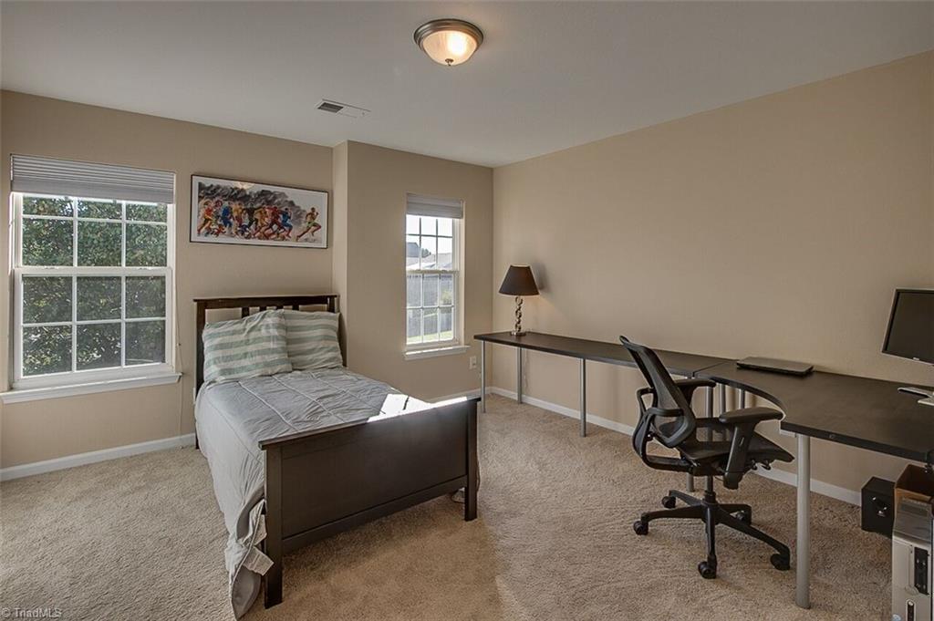 2169 Rindle Drive High Point, NC 27262 - Photo 23 of 30 Second upstairs bedroom is spacious and bright.