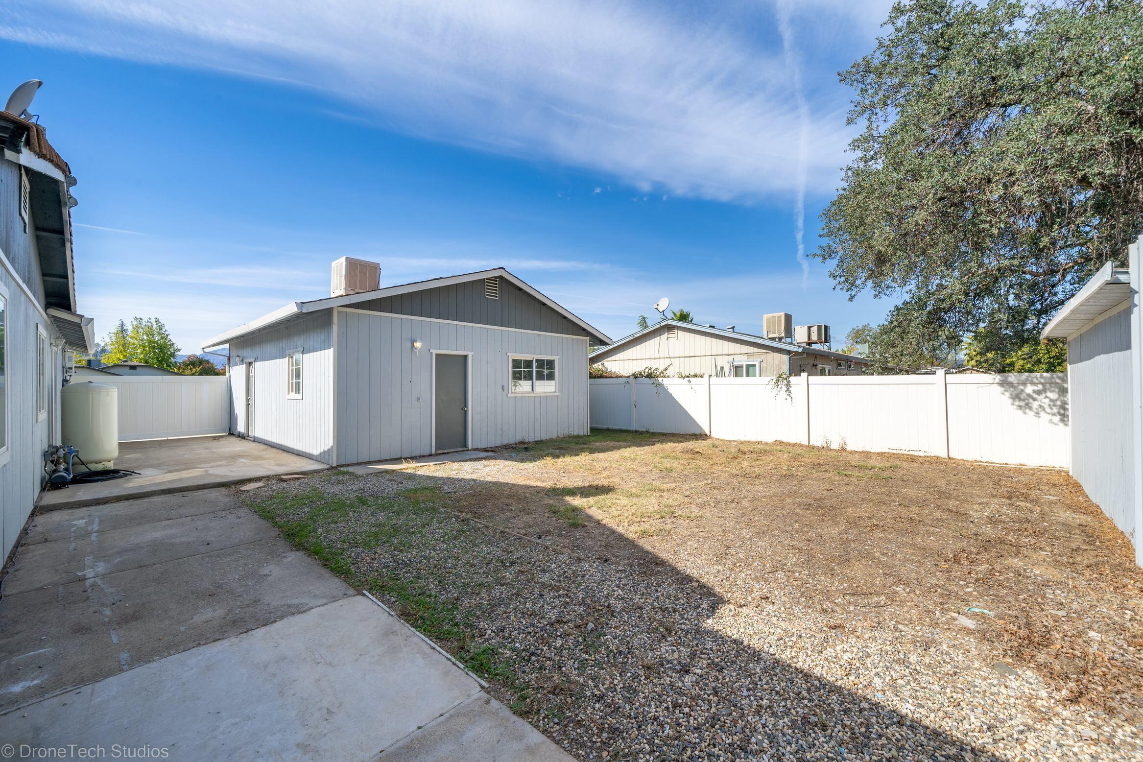 1025 Beltline Road Redding, CA 96003 - Photo 32 of 37 a house view with a backyard space