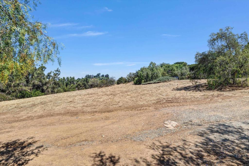 Colina Fuerte Rancho Santa Fe, CA 92067 - Photo 12 of 15 a view of a road with a yard
