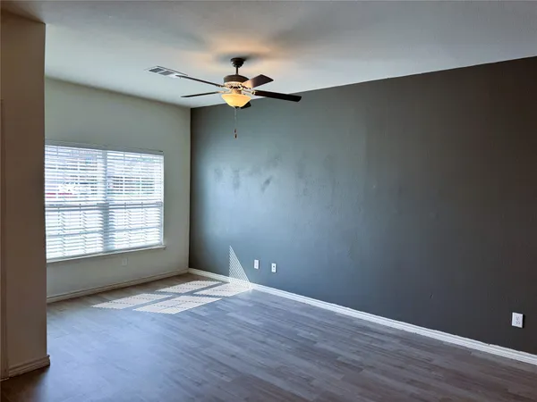 a kitchen with stainless steel appliances a refrigerator microwave stove sink and cabinets