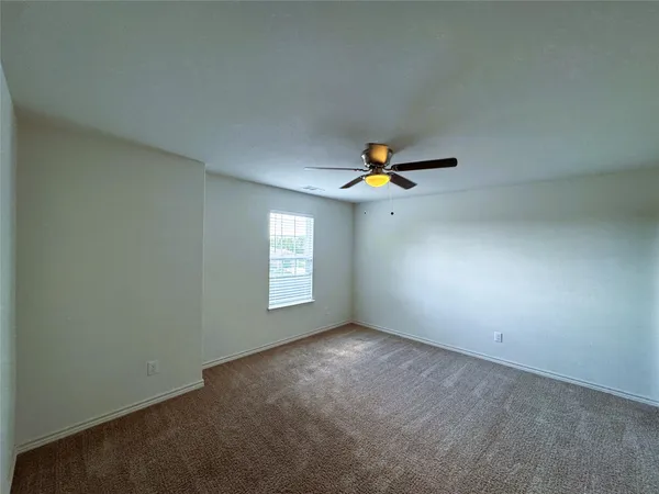 an empty room that has a window
