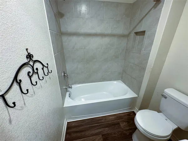 a bathroom with a sink toilet and a mirror