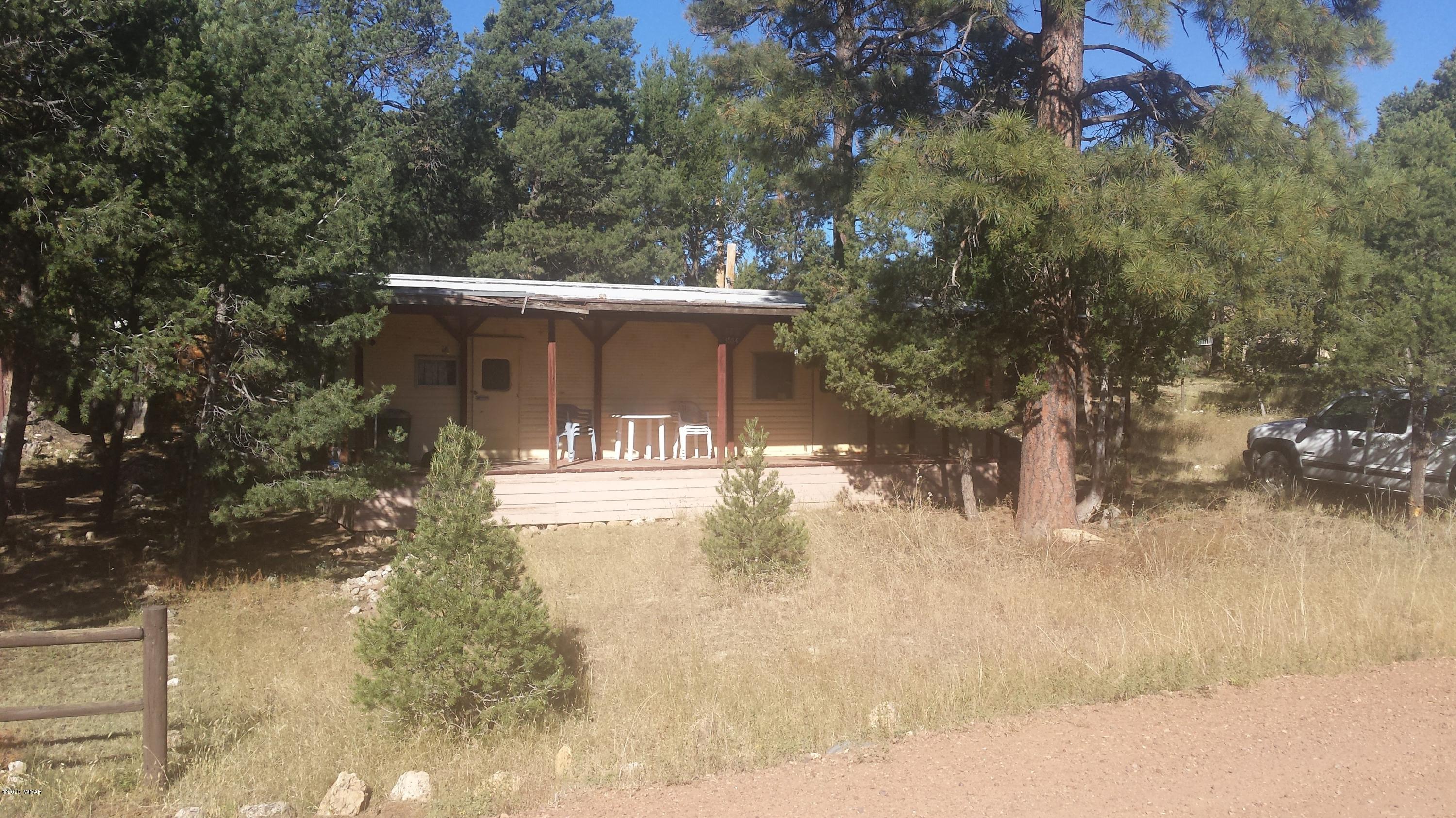 3554 Broken Arrow Road Overgaard, AZ 85933 - Photo 2 of 15 a view of a house with a yard