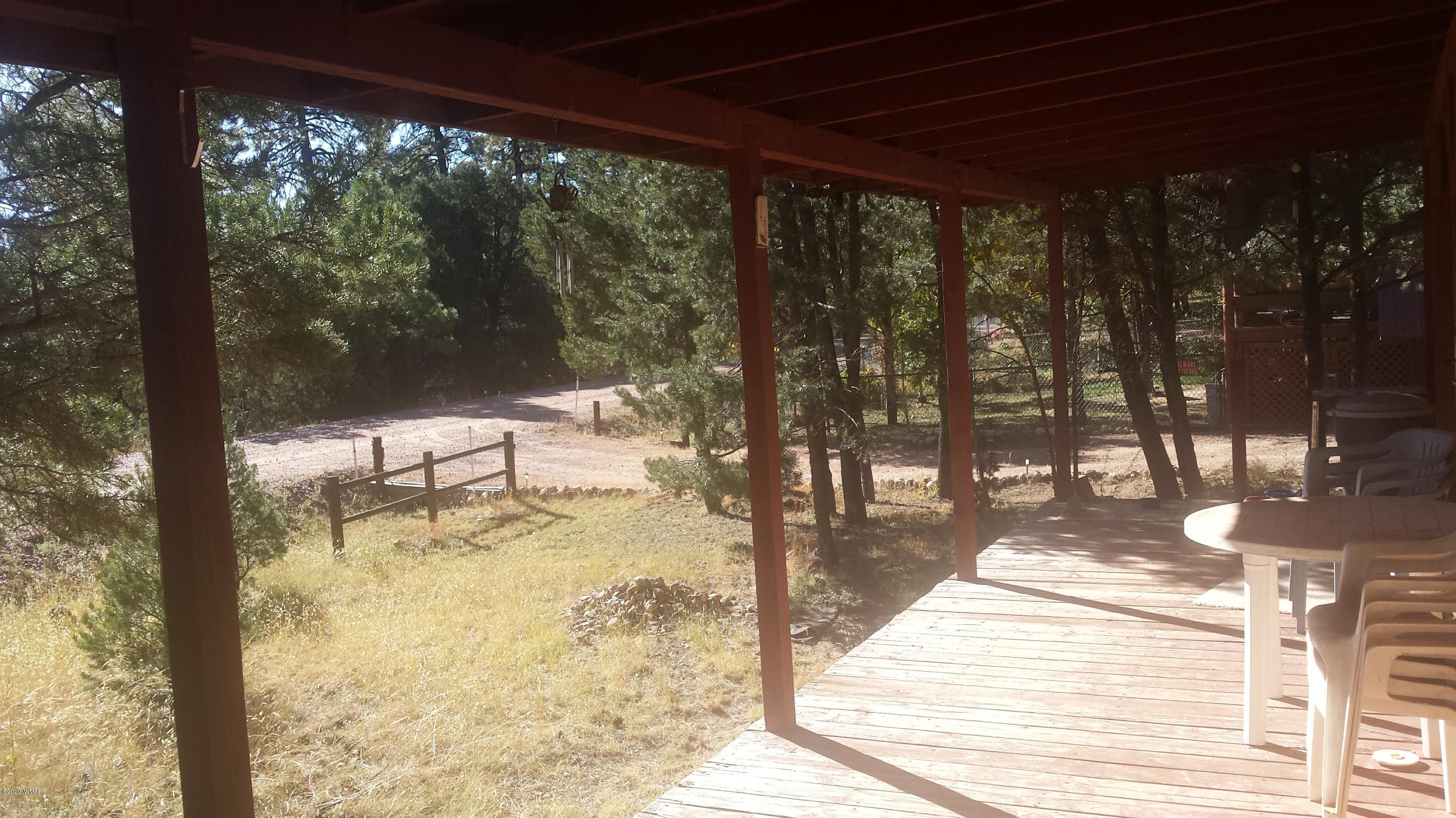 3554 Broken Arrow Road Overgaard, AZ 85933 - Photo 4 of 15 a view of a swimming pool with a patio