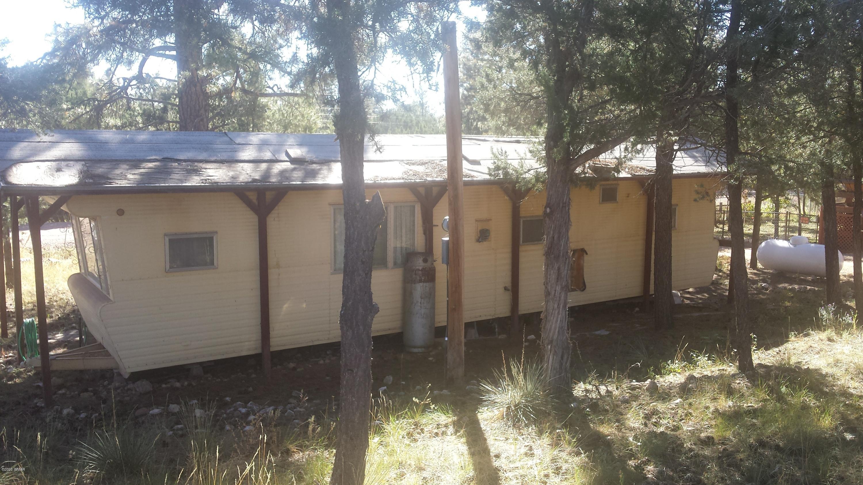 3554 Broken Arrow Road Overgaard, AZ 85933 - Photo 7 of 15 a view of a house with a yard
