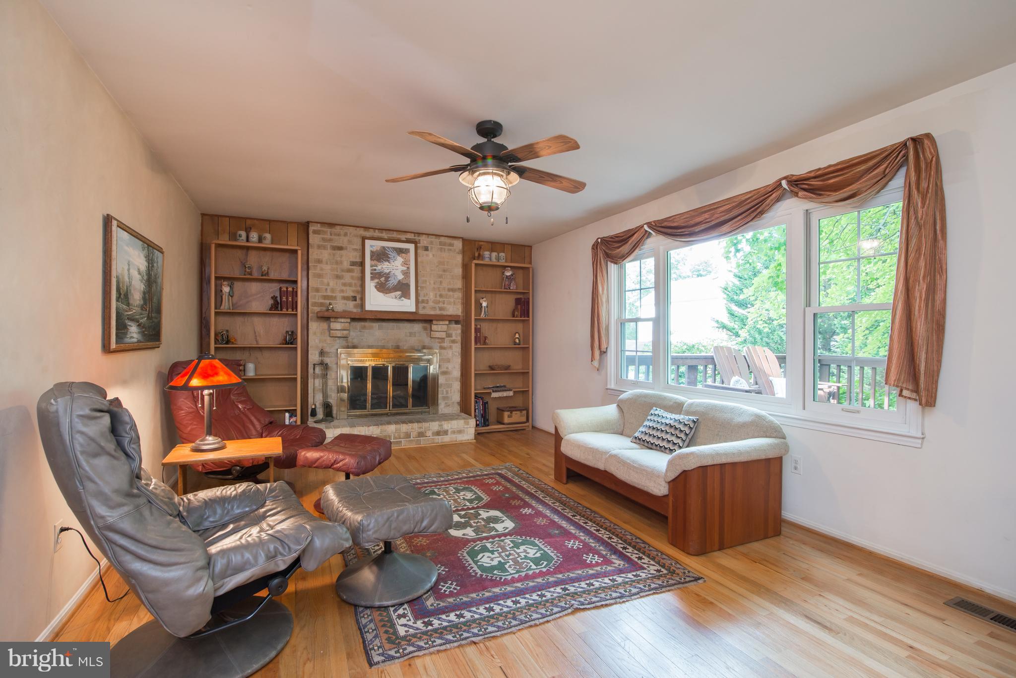 6403 Gregory Court Springfield, VA 22152 - Photo 16 of 26 Faily Room with wood burning fireplace