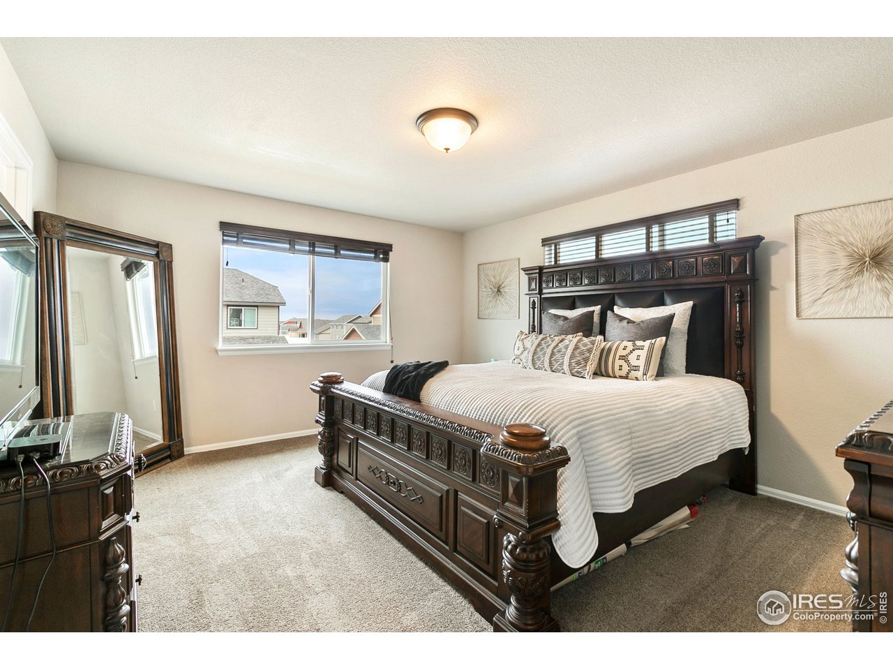 528 El Diente Avenue Severance, CO 80550 - Photo 11 of 19 a bedroom with a bed and a night stand