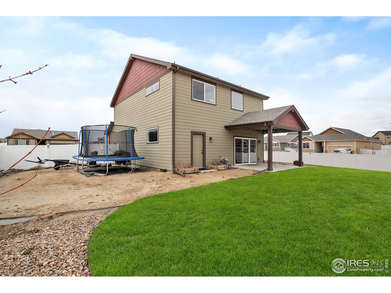 528 El Diente Avenue Severance, CO 80550 - Photo 18 of 19 a view of a house with backyard porch and garden