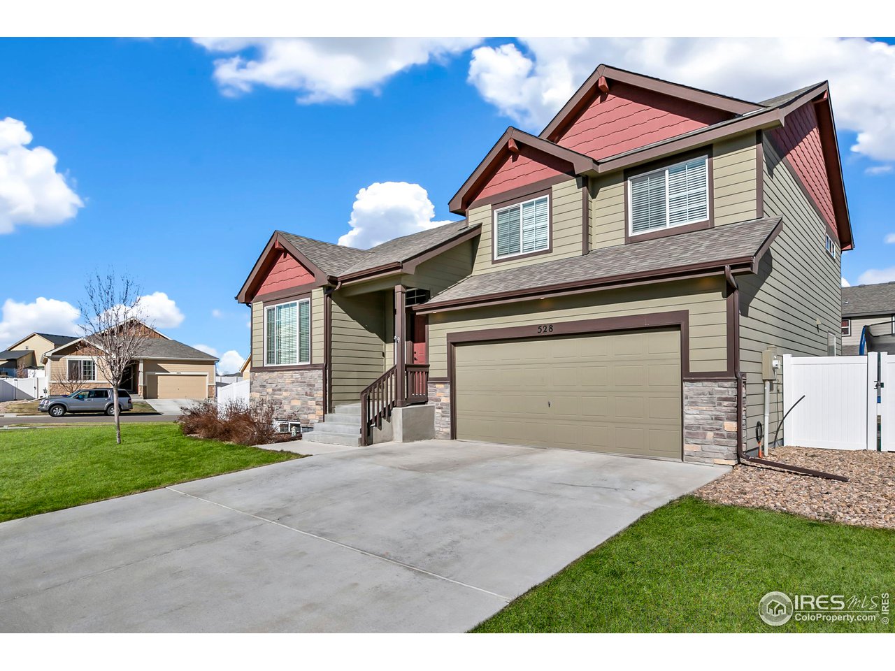 528 El Diente Avenue Severance, CO 80550 - Photo 2 of 19 a front view of a house with a garden and yard