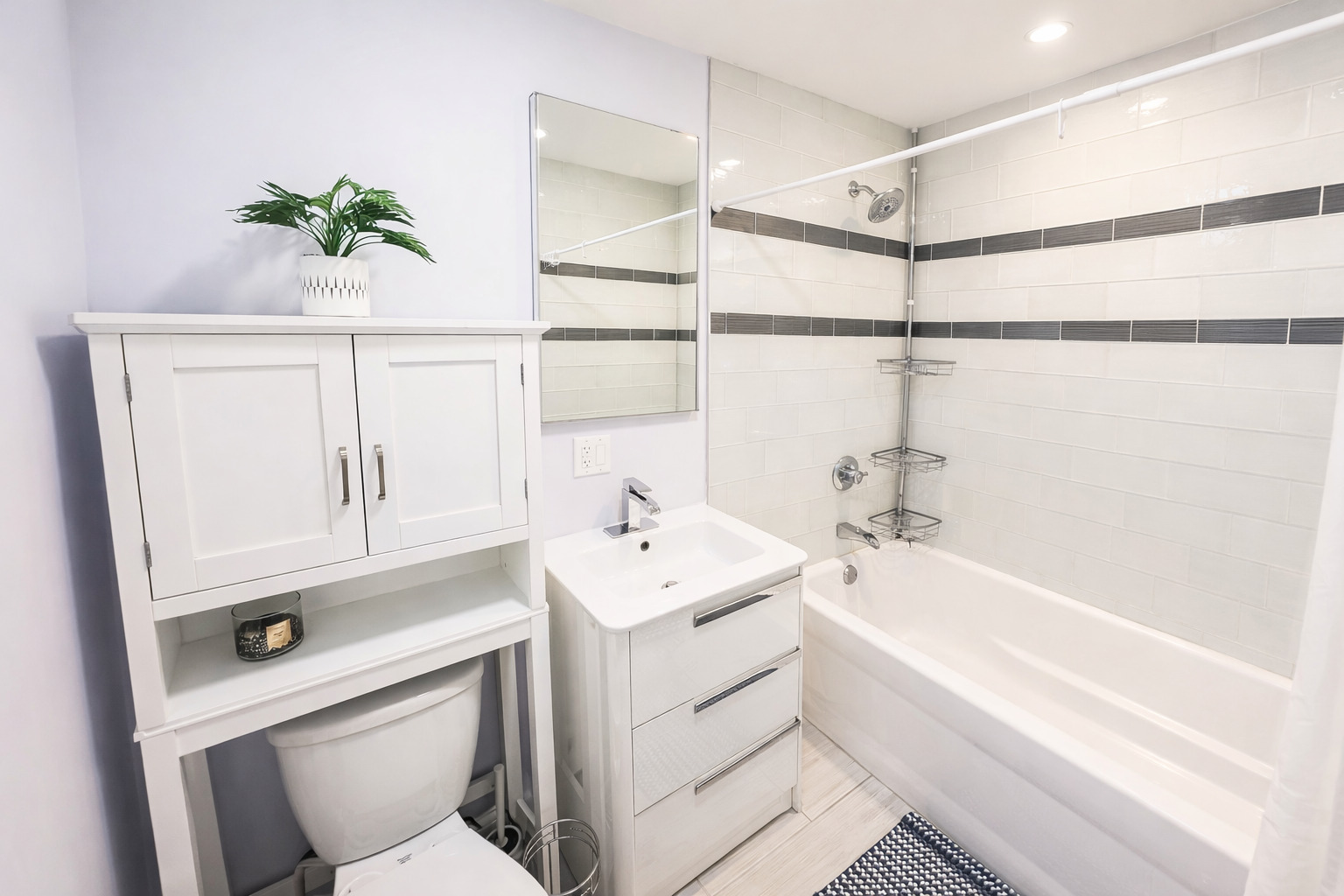 1575 Sandpebble Drive, Unit 104 Wheeling, IL 60090 - Photo 7 of 8 a bathroom with a sink a toilet and bathtub