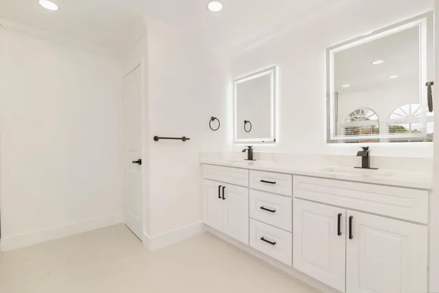 a white bath tub sitting next to a shower