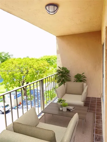 a living room with furniture potted plant and a potted plant