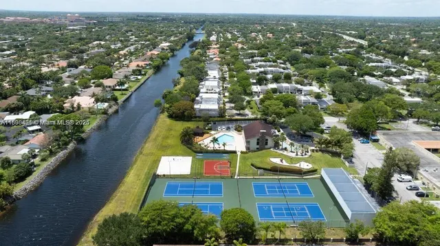 an aerial view of a house with outdoor space