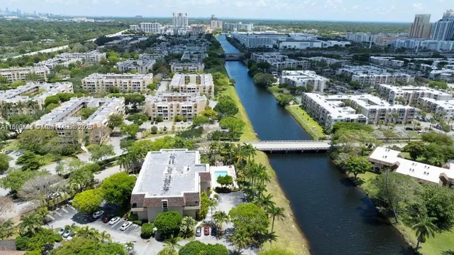 a view of a lake with houses in the back