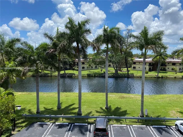 a view of a swimming pool and a yard