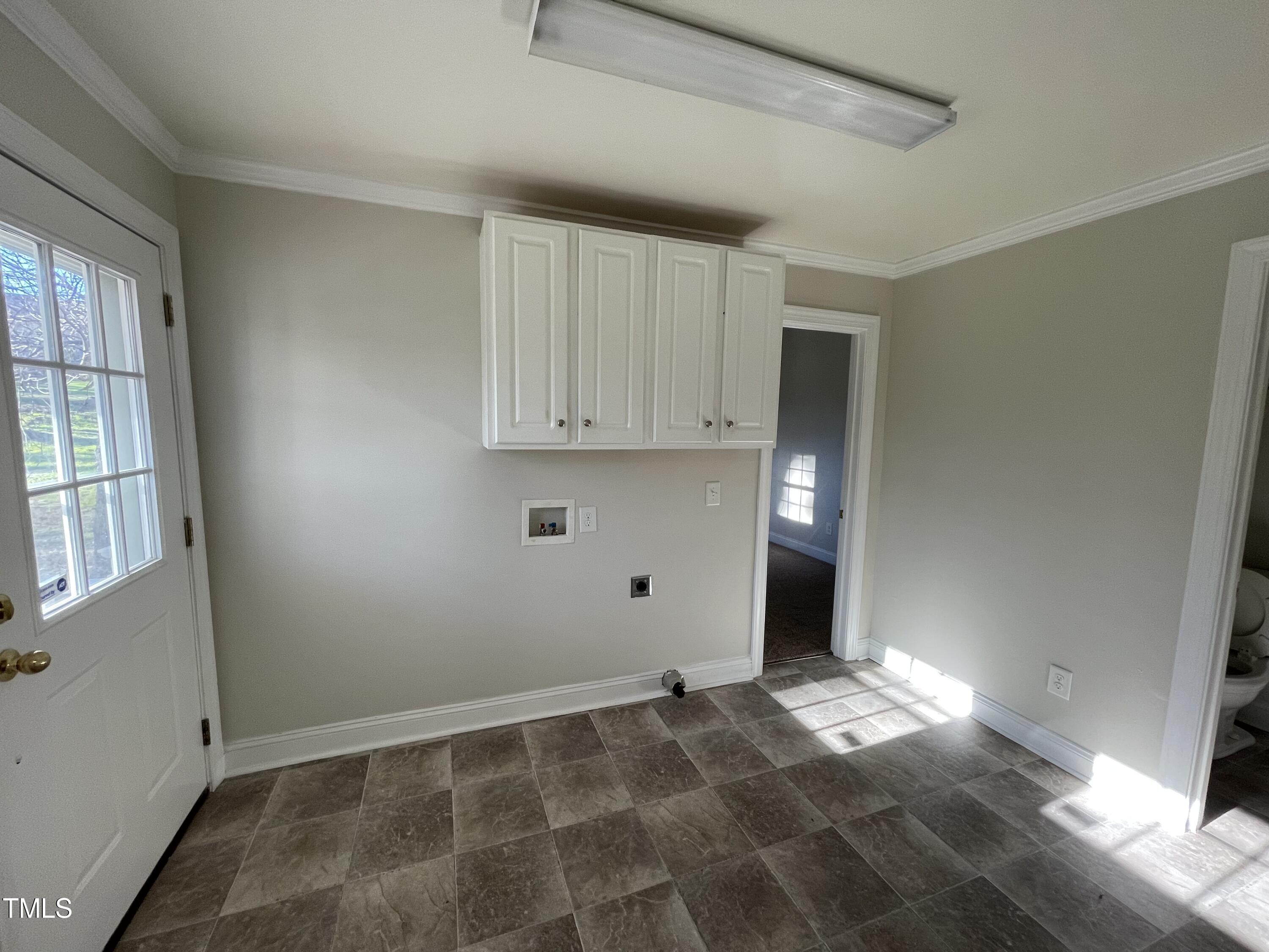 119 Academy Street Roxboro, NC 27573 - Photo 14 of 22 a view of an empty room with a window