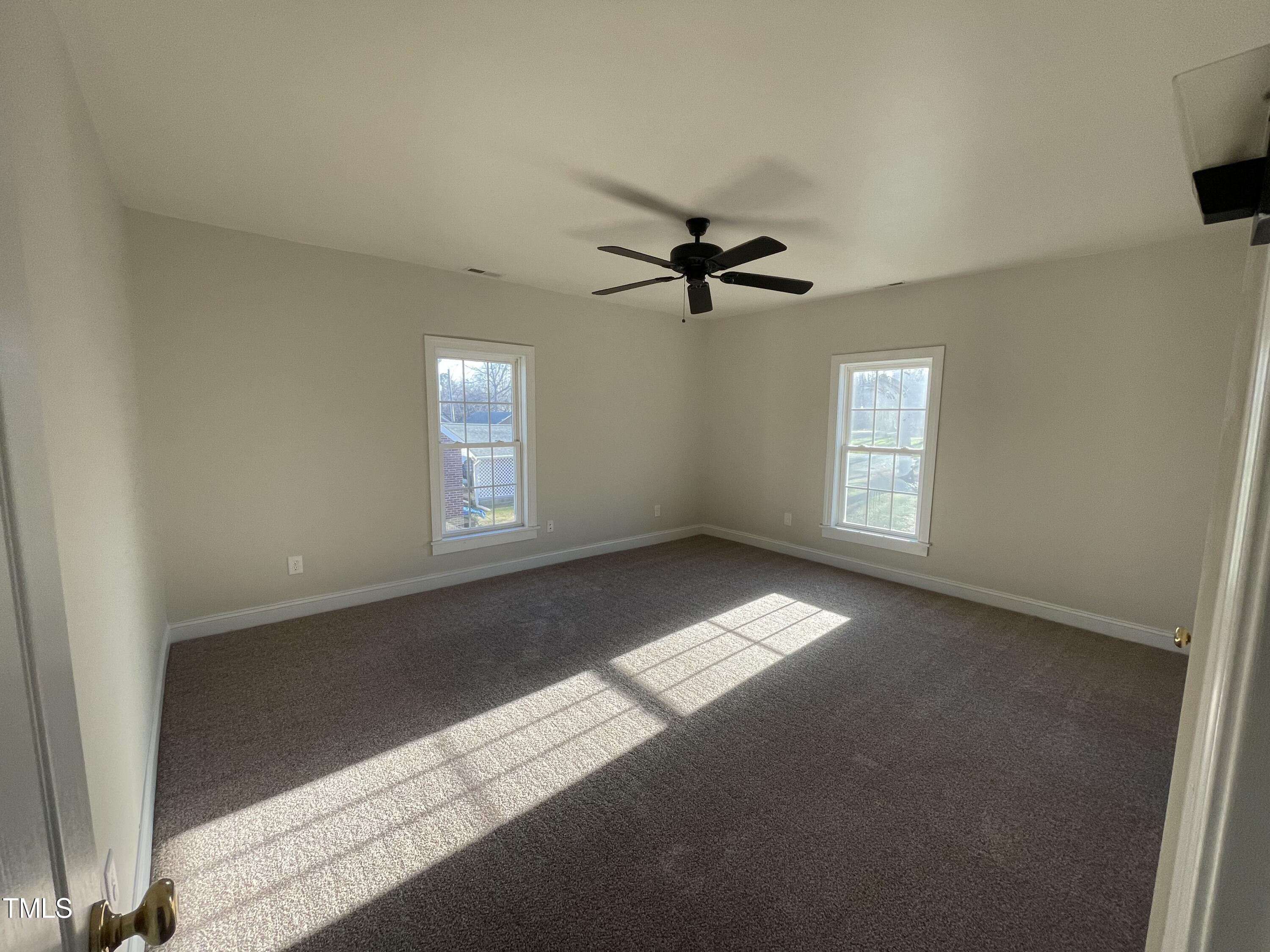 119 Academy Street Roxboro, NC 27573 - Photo 21 of 22 a view of an empty room with a window